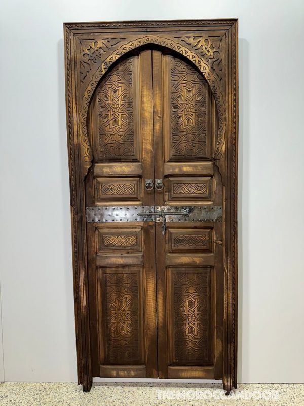 Moroccan-style handcrafted wooden door with carvings