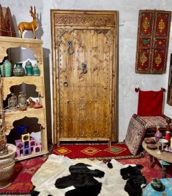 Moroccan-style handcrafted wooden door with arabesque carvings