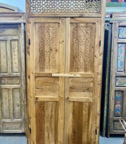 Moroccan-style handcrafted wooden door with arabesque carvings