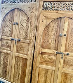Moroccan-style handcrafted wooden door with arabesque carvings