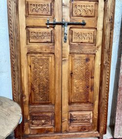 Traditional Moroccan carved wooden door with intricate details by ArabicDoors