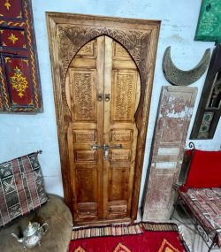 Traditional Moroccan carved wooden door with intricate details by ArabicDoors