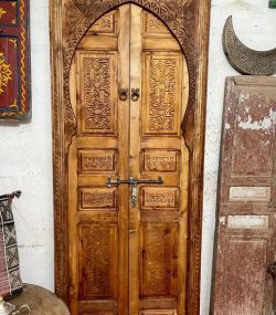 Traditional Moroccan carved wooden door with intricate details by ArabicDoors