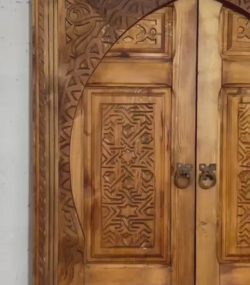 Traditional Moroccan carved wooden door with intricate details by ArabicDoors