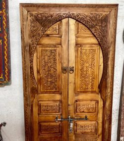 Traditional Moroccan carved wooden door with intricate details by ArabicDoors