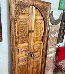 Traditional Moroccan carved wooden door with intricate details by ArabicDoors