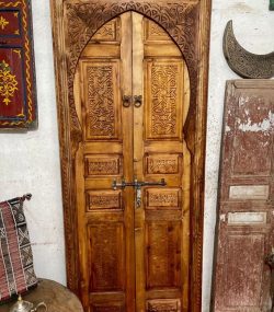 Traditional Moroccan carved wooden door with intricate details by ArabicDoors