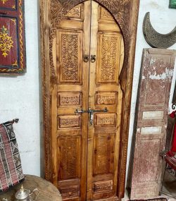 Traditional Moroccan carved wooden door with intricate details by ArabicDoors