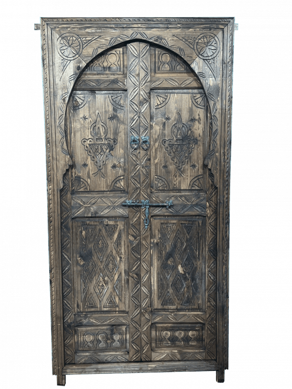 Moroccan-style handcrafted wooden door with carvings