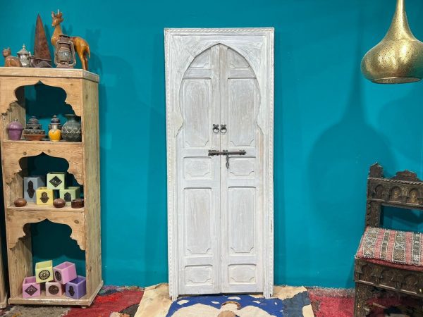 Moroccan-style handcrafted wooden door with carvings