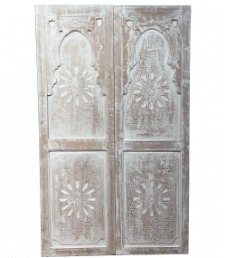 Moroccan-style handcrafted wooden door with carvings