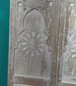 Moroccan-style handcrafted wooden door with carvings