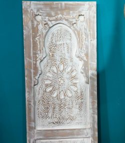 Moroccan-style handcrafted wooden door with carvings