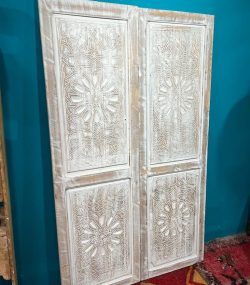 Moroccan-style handcrafted wooden door with carvings