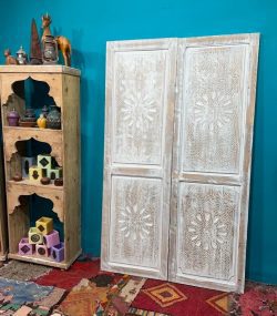 Moroccan-style handcrafted wooden door with carvings