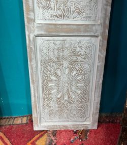Moroccan-style handcrafted wooden door with carvings