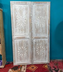 Moroccan-style handcrafted wooden door with carvings