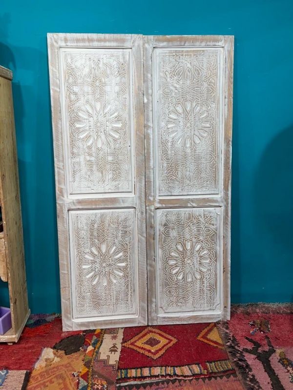 Moroccan-style handcrafted wooden door with carvings