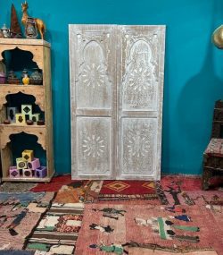 Moroccan-style handcrafted wooden door with carvings