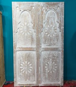 Moroccan-style handcrafted wooden door with carvings