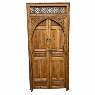 Handcrafted wooden door with intricate carvings and traditional artisan design