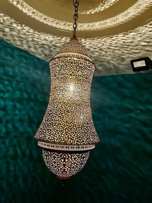 copper Moroccan vintage chandeliers with finely pierced metalwork and geometric designs