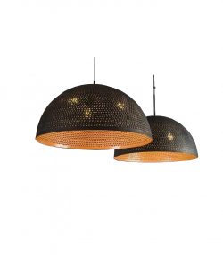 carved copper Elegant Moroccan pendant light with detailed brass carvings and a soft glow.
