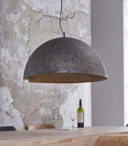 carved copper Elegant Moroccan pendant light with detailed brass carvings and a soft glow.